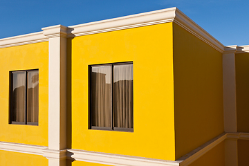 Image showing Yellow house and blue sky