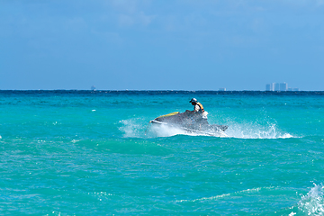 Image showing Man riding jet ski