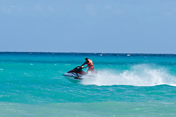 Image showing Man riding jet ski