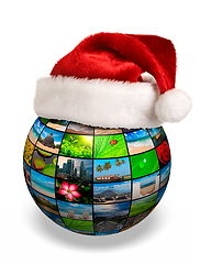 Image showing Christmas concept - photo globe in Santa hat