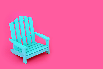 Image showing Time to Relax Alone with Blue Chair on Vivid Pink Background