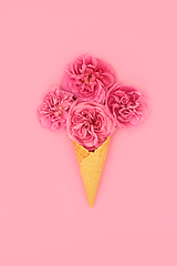 Image showing Surreal Ice Cream Cone with Red Summer Rose Flowers