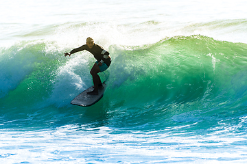 Image showing Surfing the waves