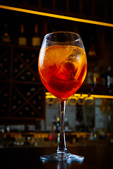 Image showing Aperol Spritz Cocktail Alcoholic beverage based on bar counter with ice cubes and oranges