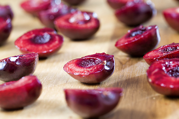 Image showing sliced red sweet cherries