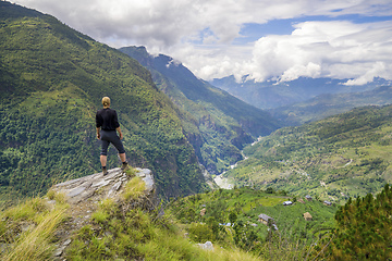 Image showing Man standing on hill top in Himalayas