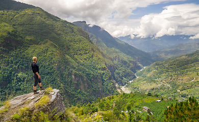 Image showing Man standing on hill top in Himalayas