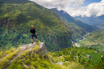 Image showing Man standing on hill top in Himalayas