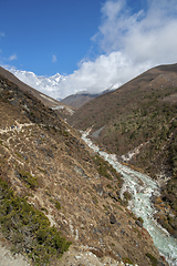 Image showing Lhotse summit, trail and river in the Himalayas