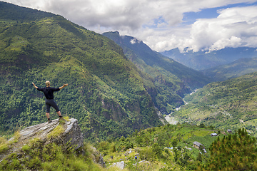 Image showing Man standing on hill top in Himalayas