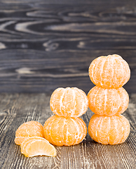 Image showing peeled sweet and juicy tangerine