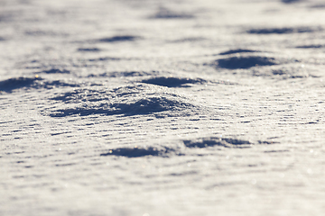 Image showing Snow drifts in winter - snow photographed in the winter season, which appeared after a snowfall. close-up,