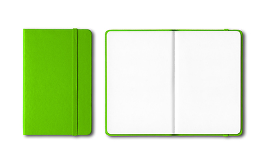 Image showing Green closed and open notebooks isolated on white