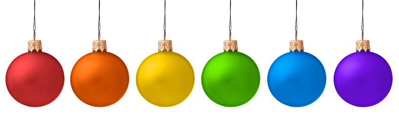 Image showing Several hanging Christmas baubles isolated