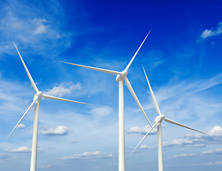 Image showing Wind generator turbines in sky