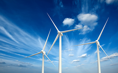 Image showing Wind generator turbines in sky