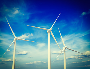 Image showing Wind generator turbines in sky