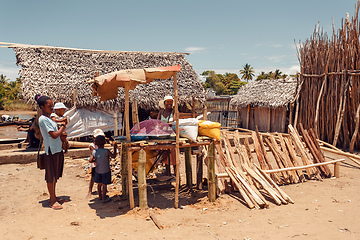 Image showing Malagasy woman on street sell firewood, Madagascar