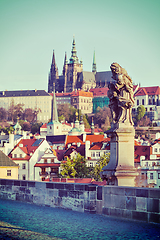 Image showing Statue on Charles Brigde against St. Vitus Cathedral in Prague