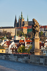 Image showing Statue on Charles Brigde against St. Vitus Cathedral in Prague