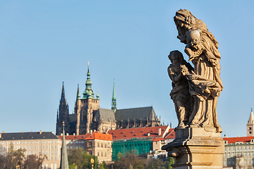 Image showing Statue on Charles Brigde against St. Vitus Cathedral in Prague