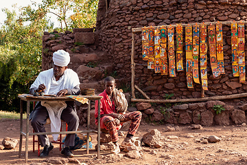 Image showing Ethiopian man paints religious motifs, Lalibela Ethiopia