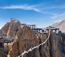 Image showing Dhankar gompa (Tibetan Buddhist monastery) and prayer flags (lun