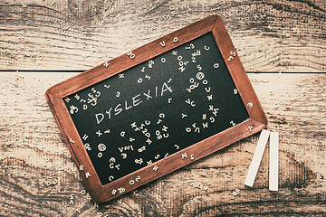 Image showing Dyslexia concept, help children with reading - old school blackboard with chalk