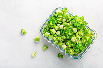 Image showing Fresh  organic green brussel sprouts and small winter cabbage vegetable in glass container, ready to freeze