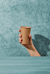 Image showing paper coffee cup in human hand