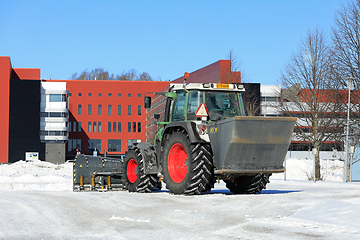 Image showing Tractor Ploughing Snow and Spreading Grit