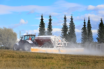 Image showing Tractor Spreading Agricultural Lime in Field