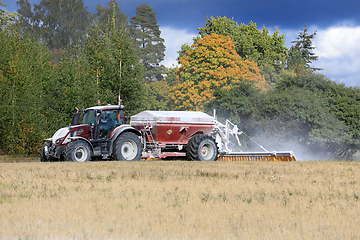 Image showing Valtra Tractor Spreading Agricultural Lime in Field