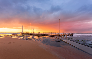 Image showing Sunrise and cstorm clouds over Mona Vale Ocean pool