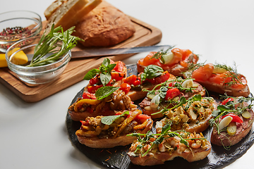 Image showing Set of assorted bruschetta with various toppings for holiday. To