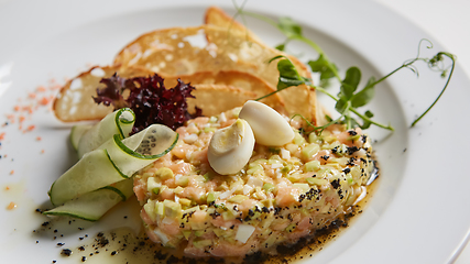 Image showing The salmon tartare with avocado. Shallow dof