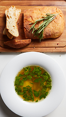 Image showing Hot broth with ravioli and green onions. Studio Photo.