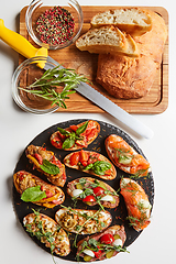 Image showing Set of assorted bruschetta with various toppings for holiday. To