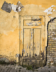 Image showing closed yellow wooden door