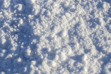 Image showing Snow after snowfall - snow lying in snowdrifts after the last snowfall. Photo in the winter in the field.