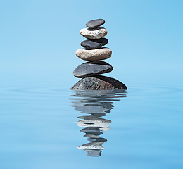 Image showing Zen balanced stones stack in lake balance peace silence concept