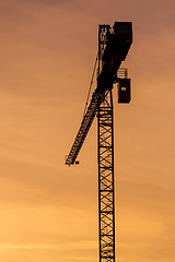 Image showing Building crane silhouettes in sky