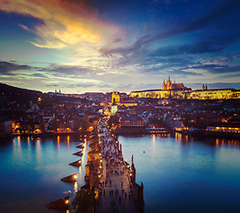 Image showing Night view of Prague castle and Charles Bridge over Vltava
