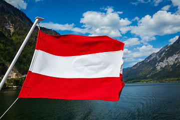 Image showing Austrian flag agains mountain lake