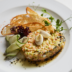 Image showing The salmon tartare with avocado. Shallow dof