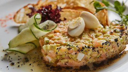 Image showing The salmon tartare with avocado. Shallow dof