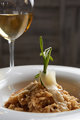 Image showing Italian dish risotto with wild white mushrooms and Parmesan chee