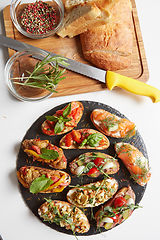 Image showing Set of assorted bruschetta with various toppings for holiday. To