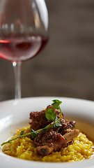 Image showing The ossobuco and saffron risotto. Shallow dof