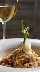 Image showing Italian dish risotto with wild white mushrooms and Parmesan chee